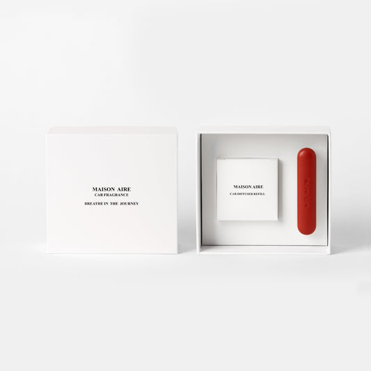 Maison Aire car fragrance gift pack set with a white box scents refill pack labeled Breathe in the Journey and a red car diffuser with refill inside