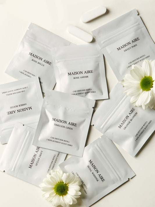 MAISON AIRE car freshener refill scent packets with white flowers on light background