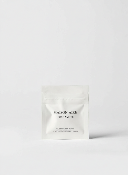 Maison Aire Rose Amber car diffuser refill pack with two replacement scent disks on white background, scent inspired by Chanel Coco Mademoiselle