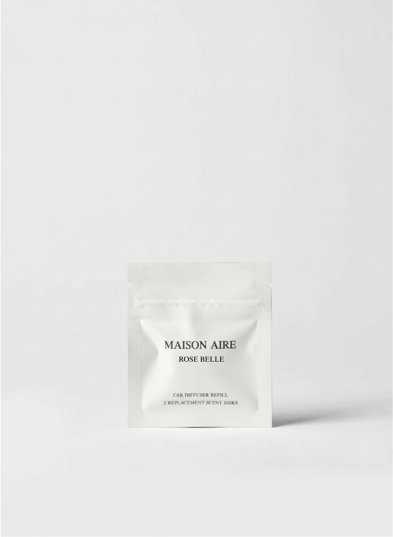 Maison Aire Rose Belle car diffuser refill pack with two replacement scent disks on white background, scent inspired by Miss Dior 