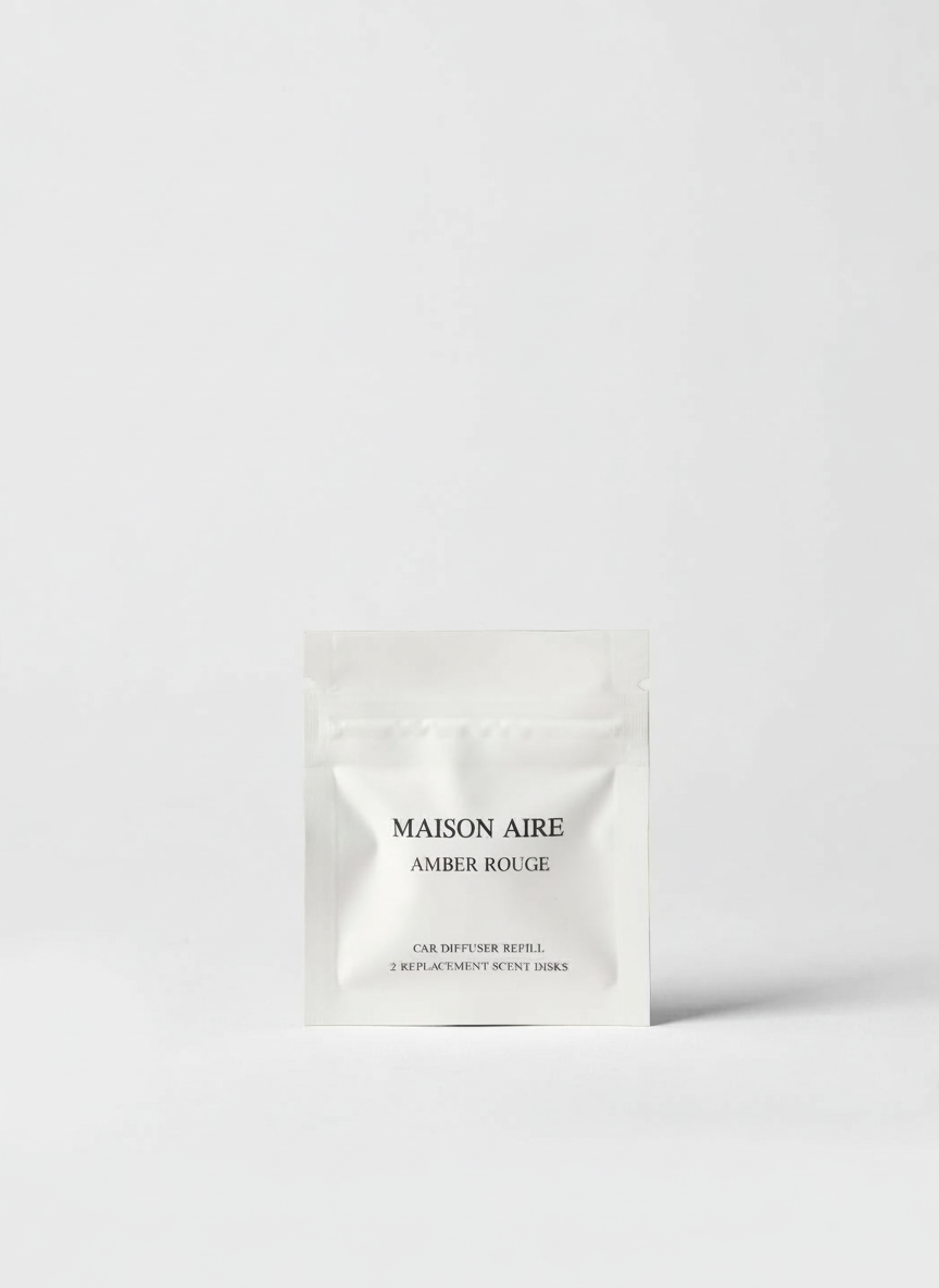 Maison Aire Amber Rouge car diffuser refill packet with two replacement scent disks on white background