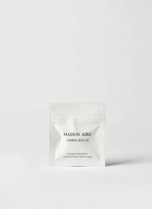 Maison Aire Amber Rouge car diffuser refill packet with two replacement scent disks on white background